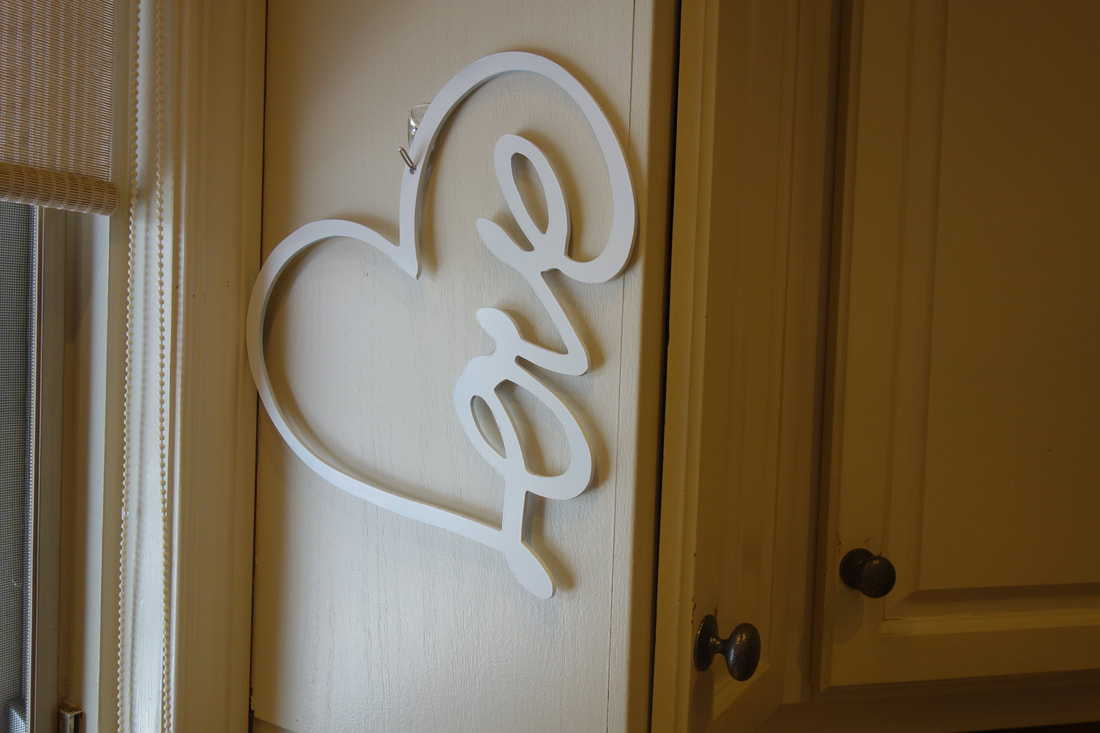white steel powder coated love sign