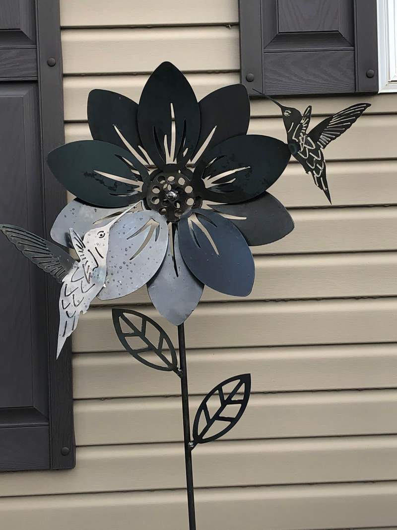 steel cut out hummingbirds drinking from flower for garden decor