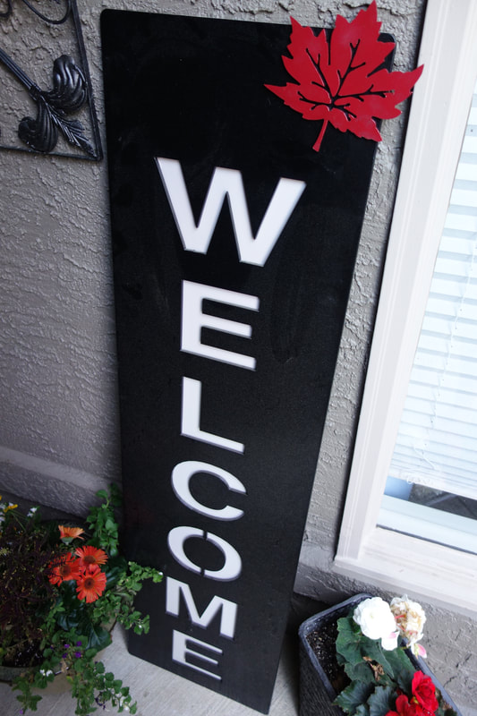 red and black welcome sign decor
