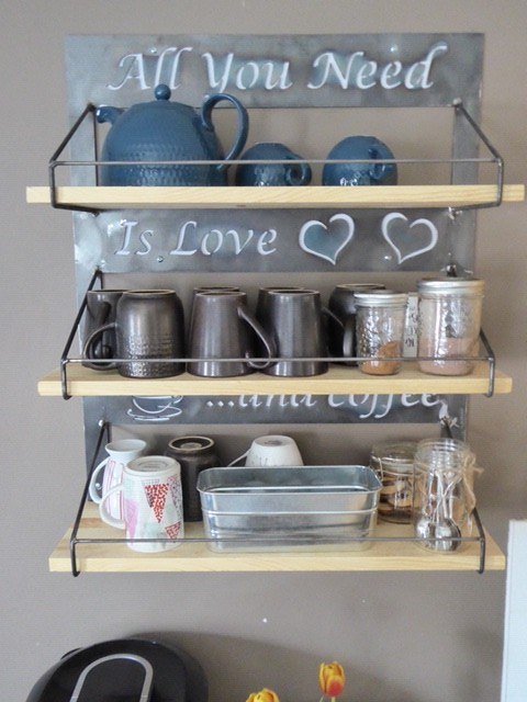 shelves with quote engraved in steel