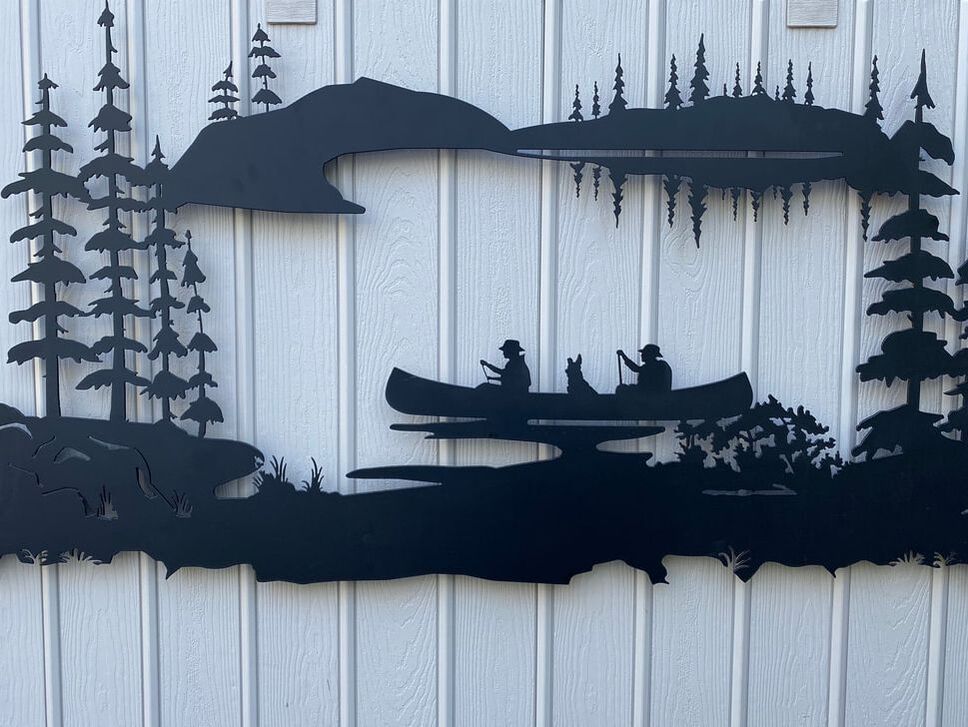 canoe and pine trees wall sign