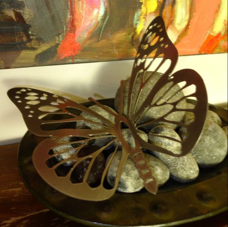 monarch butterfly steel art with painting on the wall